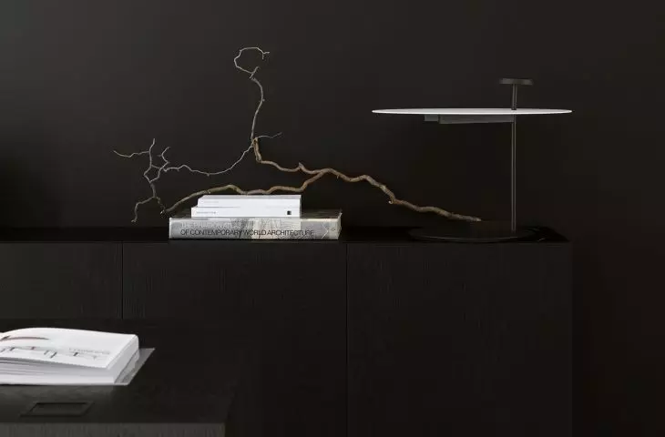 Behind the desk is a cabinet of similar form