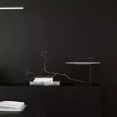 Behind the desk is a cabinet of similar form