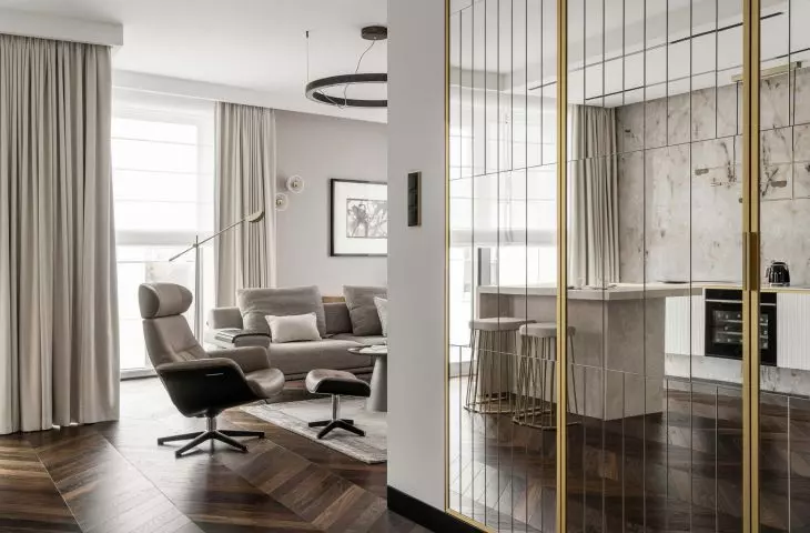 In the hallway there is a mirrored closet with gold elements