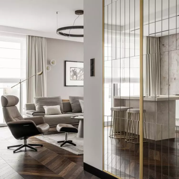 In the hallway there is a mirrored closet with gold elements