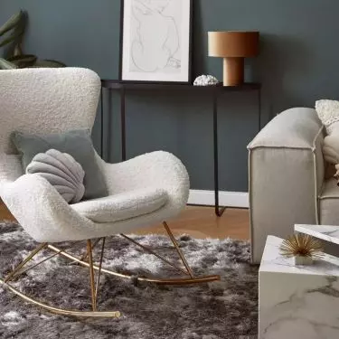 The rocking chair should match the style of the interior