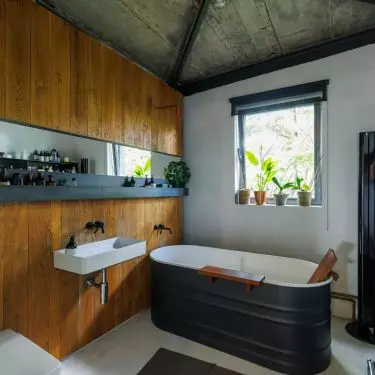 The wall of the bathroom was covered with wood