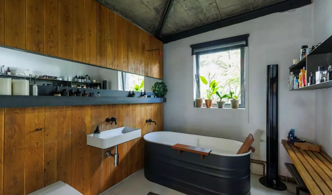 The wall of the bathroom was covered with wood