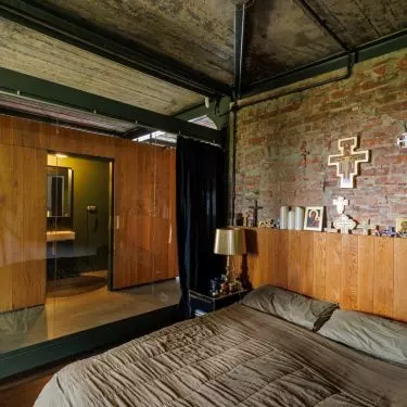 In the glazed bedroom, wood combines with brick
