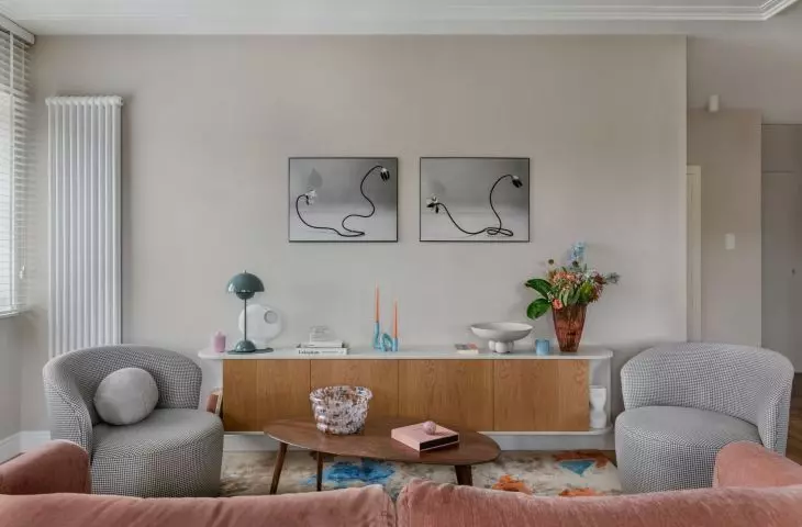 The vintage chest of drawers was juxtaposed with ornate lounge furniture