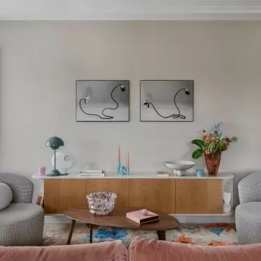 The vintage chest of drawers was juxtaposed with ornate lounge furniture