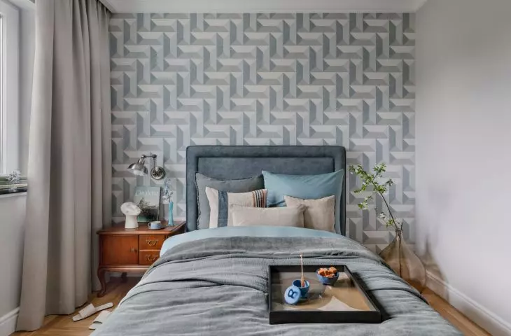 The modern bed was juxtaposed with loft and vintage elements