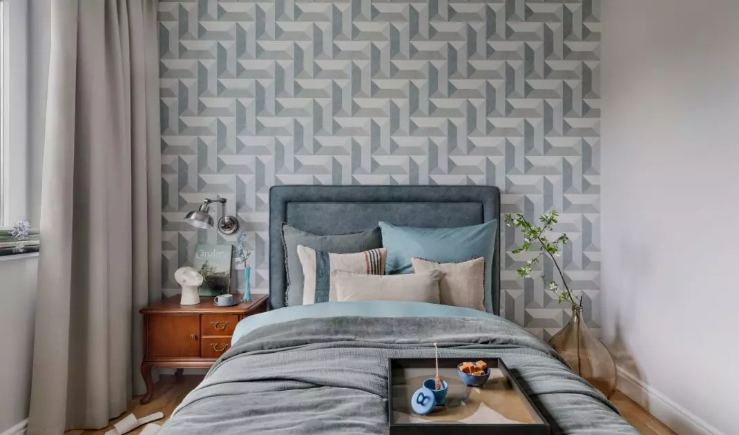 The modern bed was juxtaposed with loft and vintage elements