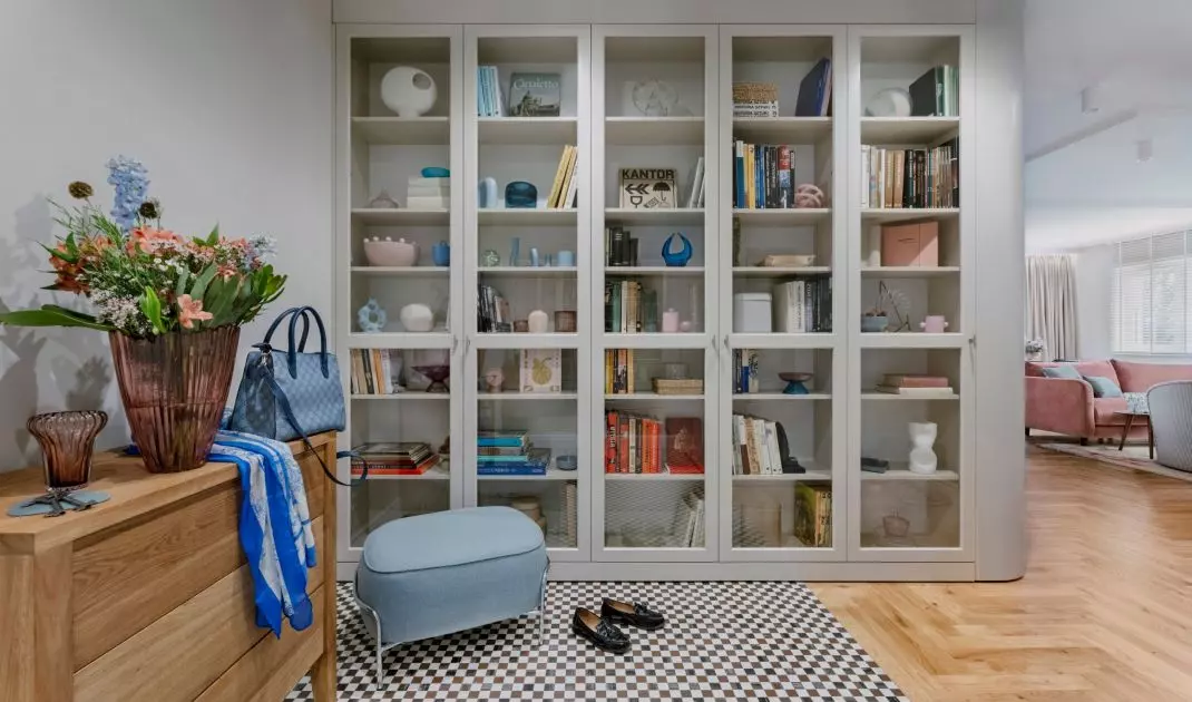 The interior is filled with books, flowers and trinkets