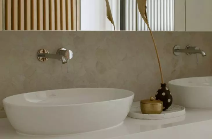 The bathroom uses a warm shade of wood