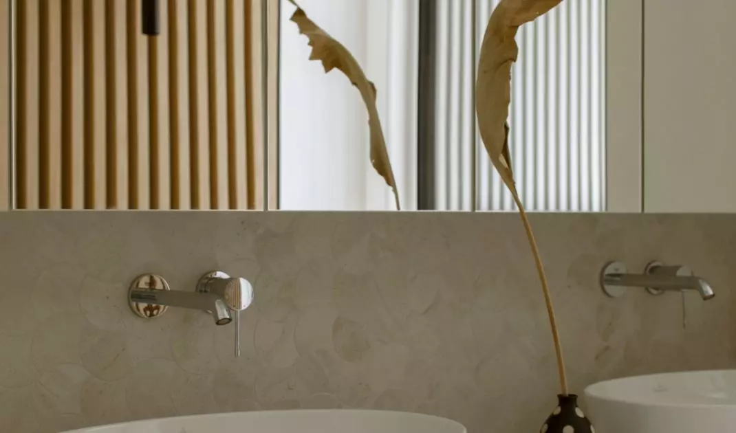 The bathroom uses a warm shade of wood