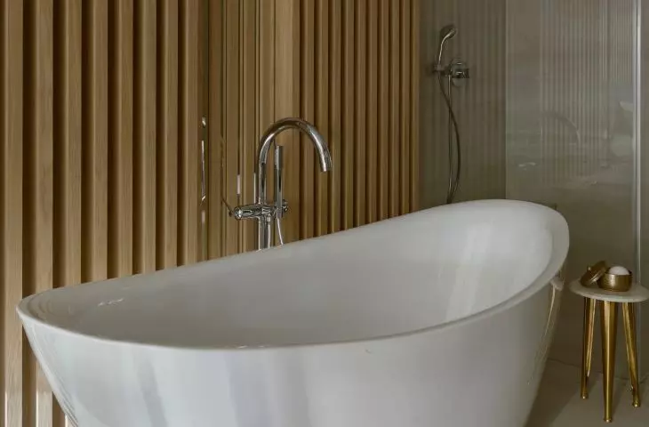 The bathroom has a freestanding bathtub