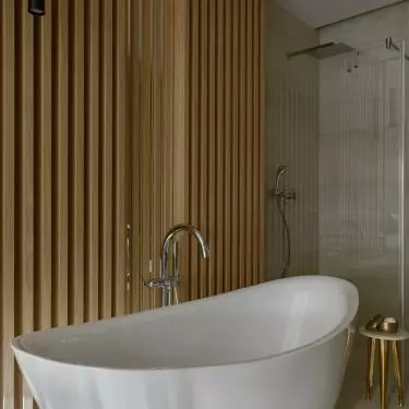 The bathroom has a freestanding bathtub