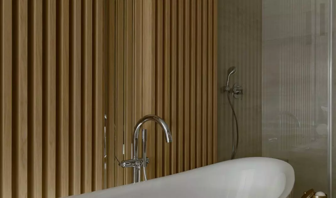 The bathroom has a freestanding bathtub