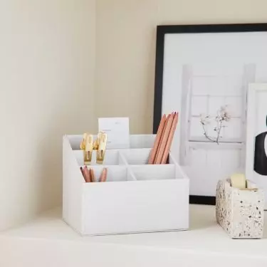 A box for writing accessories is the foundation of a well-organized desk 