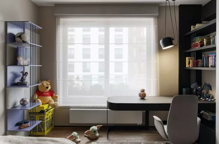 Purple bookcases provide a place to display the tenant's favorite items