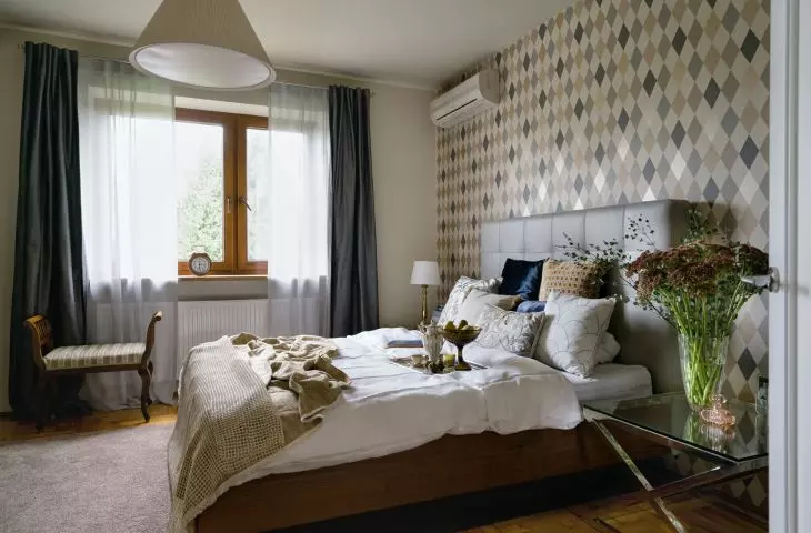 In the bedroom there is a Louis Philippe style seat