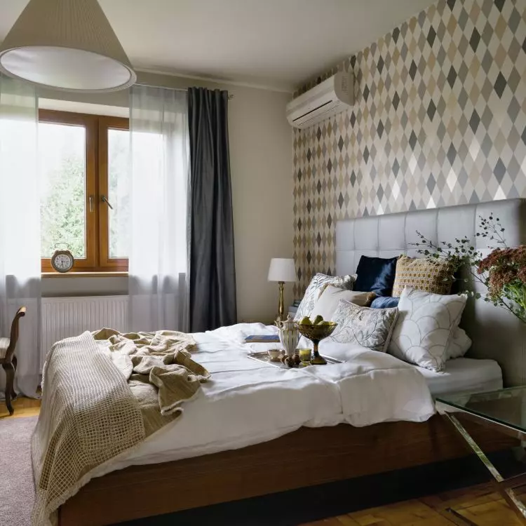 In the bedroom there is a Louis Philippe style seat