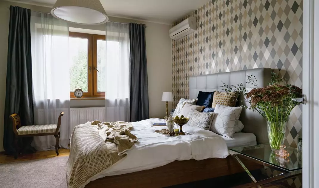 In the bedroom there is a Louis Philippe style seat