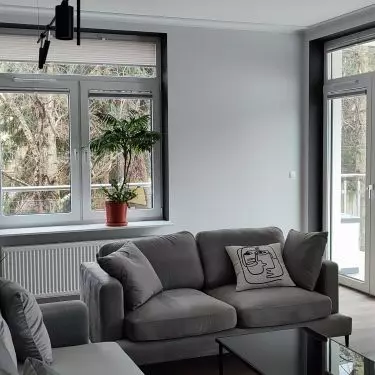 The lounge furniture has been arranged in such a way that the living room is open to the rest of the living area