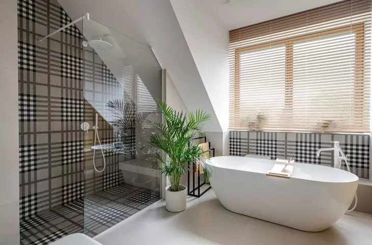 The children's bathroom has both a bathtub and a shower