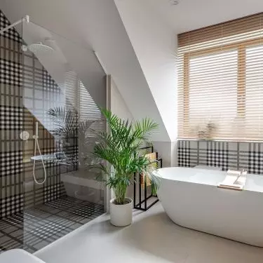 The children's bathroom has both a bathtub and a shower