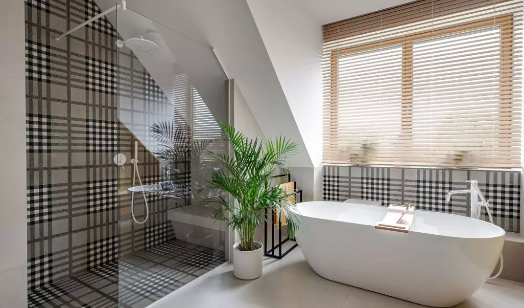 The children's bathroom has both a bathtub and a shower