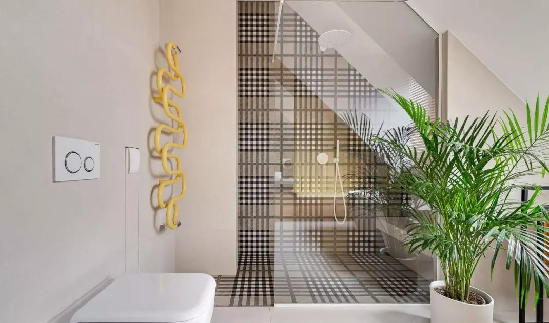 Part of the walls were covered with tiles in the Burberry check pattern