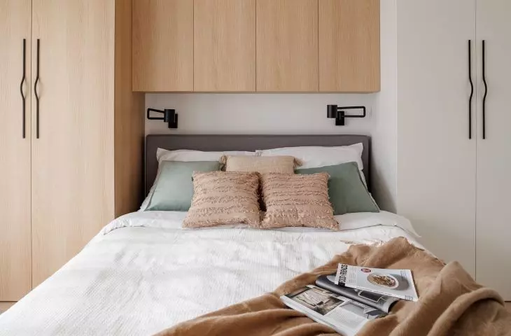 The wall behind the bed was covered with built-ins