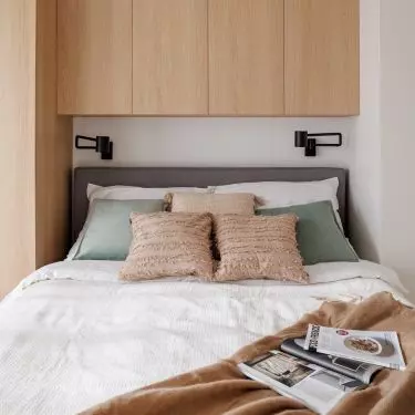 The wall behind the bed was covered with built-ins