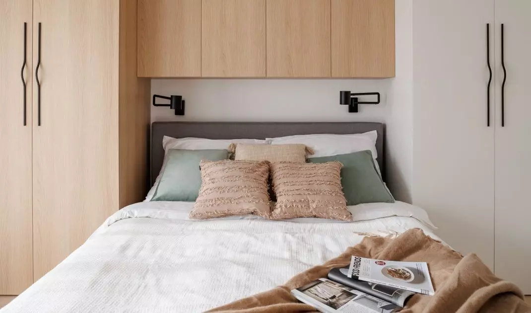 The wall behind the bed was covered with built-ins