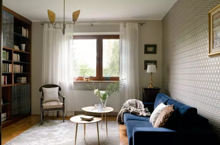 In the living room there is a large bookshelf