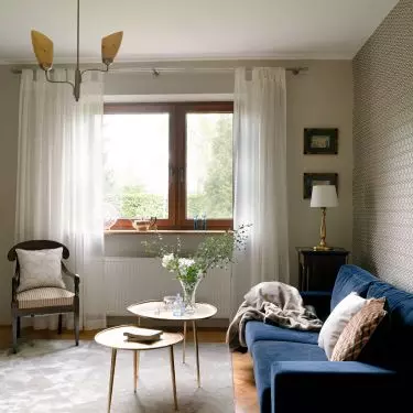 In the living room there is a large bookshelf