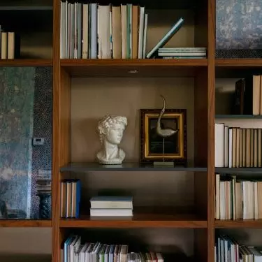 The bookcase was made of MDF veneered with American walnut