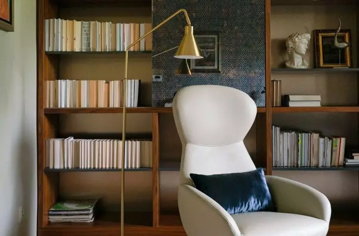 Part of the bookcase has sliding panels finished with a mirror
