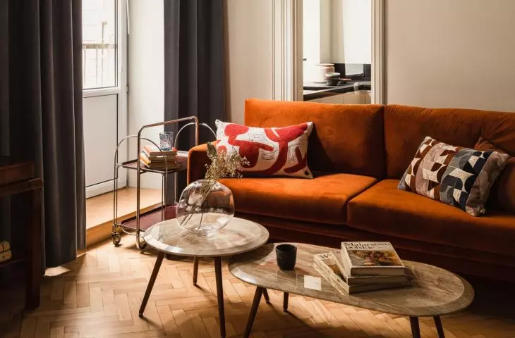 The kitchen is separated from the lounge area by a vertical window