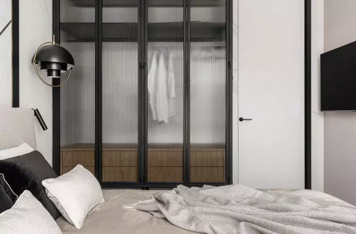 The architect placed a large closet of her own design in the bedroom