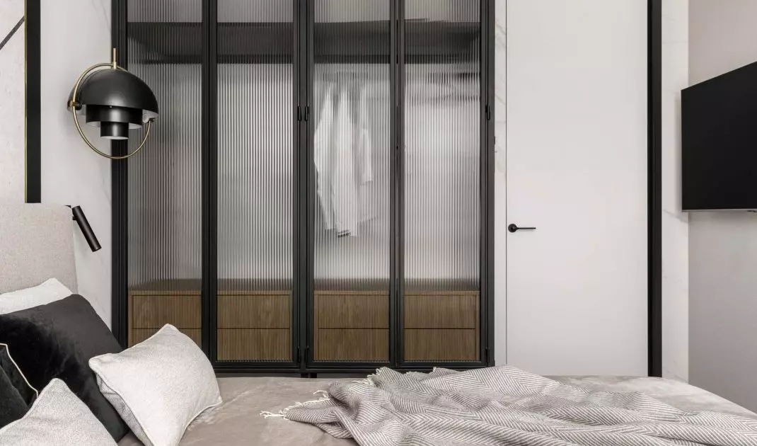 The architect placed a large closet of her own design in the bedroom
