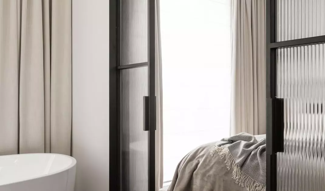 Ornamental glass was also used in the sliding door leading to the bathroom