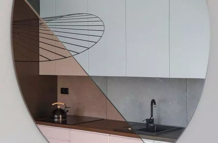 The use of a mirror provides an interesting visual effectn