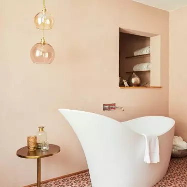 Turn your bathroom into a real bath room with a bathtub and patterned tiles