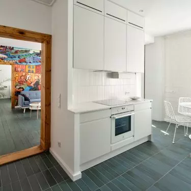 Sparrow painting-inspired murals bring color to subdued setting