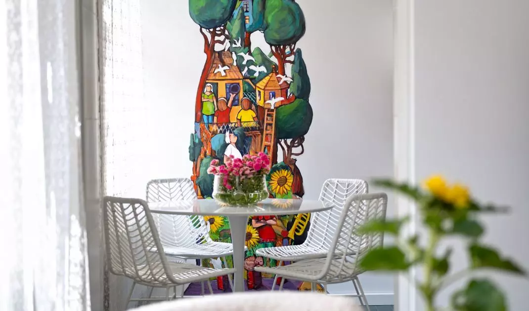 The second mural adorns a wall in the kitchen and dining room