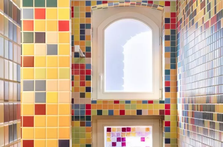 Colors taken from the murals were transferred to the mosaic in the bathroom