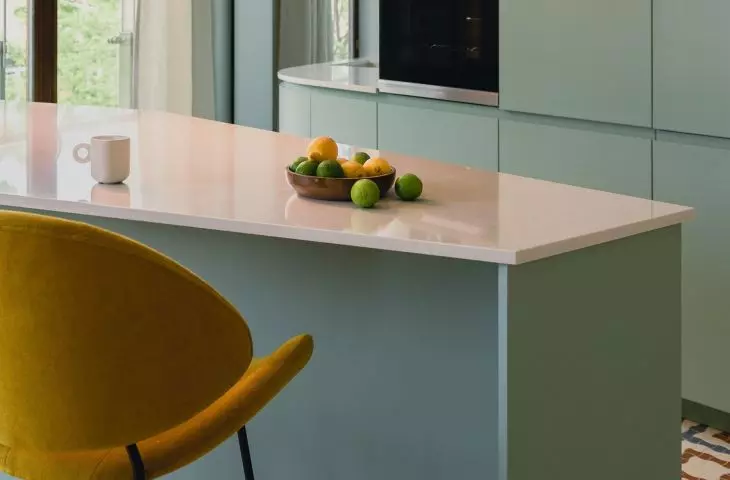 Trapezoid-shaped island separates the kitchen from the dining room