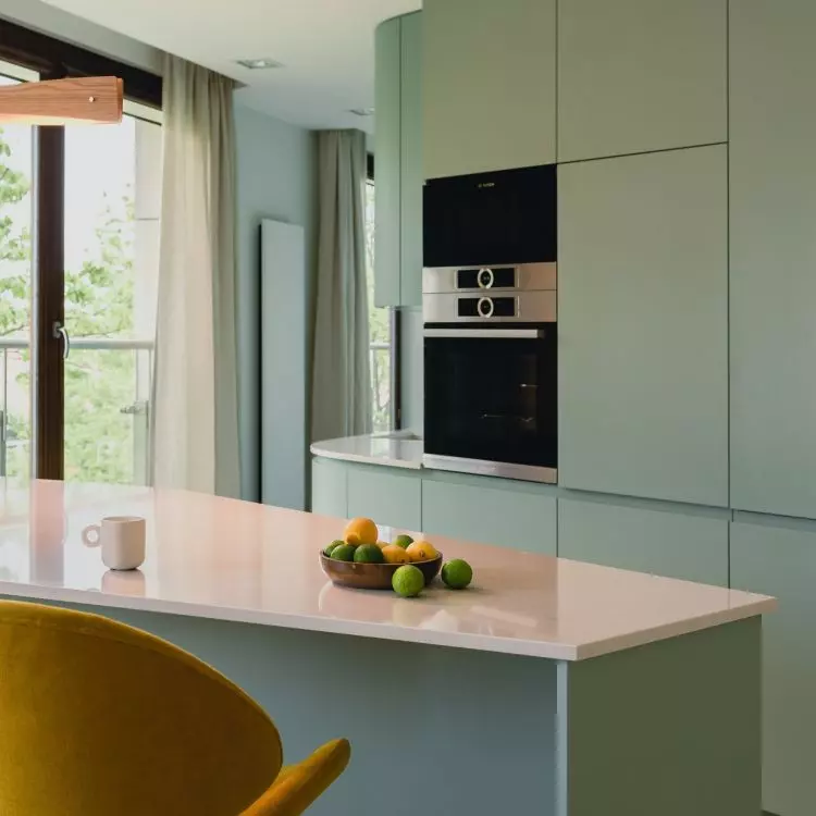 Trapezoid-shaped island separates the kitchen from the dining room