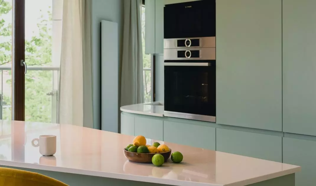 Trapezoid-shaped island separates the kitchen from the dining room