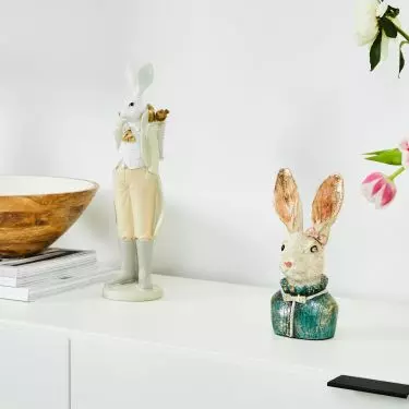 Place a figurine of a hare resembling a fairy tale character on the dresser