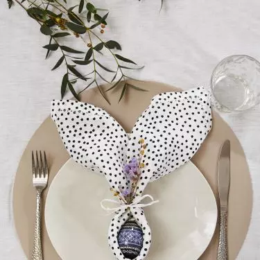 Easter egg with bunny ears from a napkin will be a beautiful table decoration