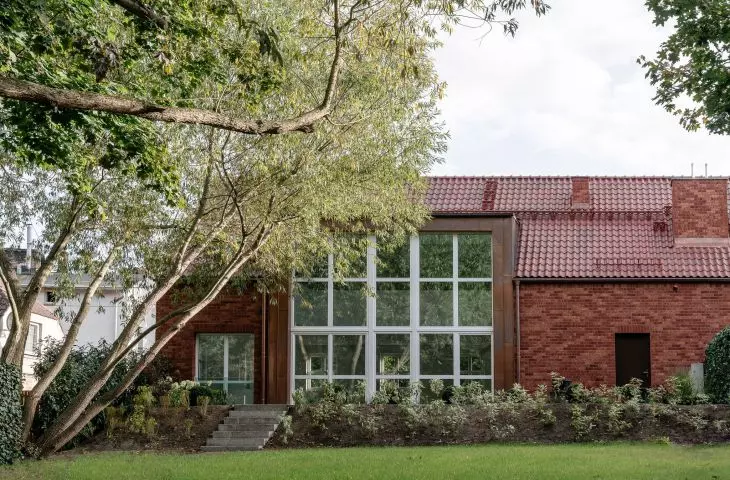 Architects designed large storefronts overlooking the garden